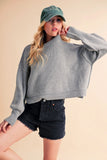 Ribbed Hem Exposed Seam Round Neck Sweater