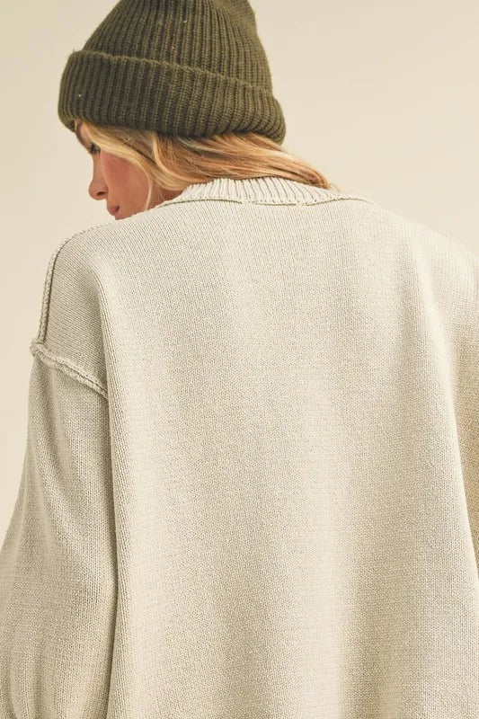 Ribbed Hem Exposed Seam Round Neck Sweater