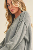 Ribbed Hem Exposed Seam Round Neck Sweater